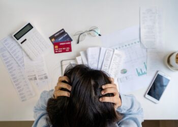 Stressed,Young,Woman,Calculating,Monthly,Home,Expenses,,Taxes,,Bank,Account